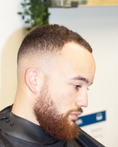 Afro Fade Skin faded on the sides into top. Shape up on frontal areas.