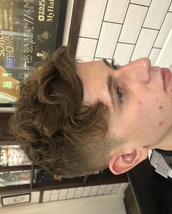 All in the natural curls Clean up on the side textured top and sliced to create movement