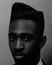 Asymetrical freehand afro An asymmetric freehand cut creating movement