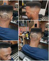 Boyz in the hood High top skin fade, lower level front parting and portrait design in the back.