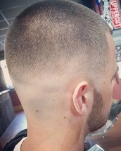 Buzzzzzzz This is a bald fade into a grade 2 on top, sharp line up and blunted across the front to k