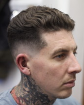 Charlie Baker Skinfade with a slight drop keeping tiny bit of weight to surrport the top.