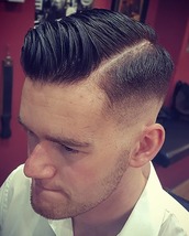 Classic side part, skin fade Skin fade and a classic hard-part side 0arting for this classy gent.