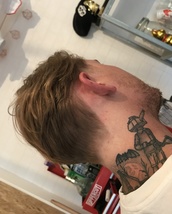 Cobain Scissor cut; Lots of texture and length graduating backwards into the nape with soft tapers t