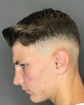 Combover Skin fade with plenty of movements and volume and textured on the top.