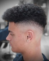 Faded Skin fade on the sides, maintaining the length on top. Don't normally get to work with much af