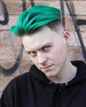 Fades of green Skinfade with pointed outlines, waved of set parting with green colour hair