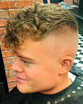 Fix up look sharp High skin fade, with a textured choppy top styled ready for a night out 