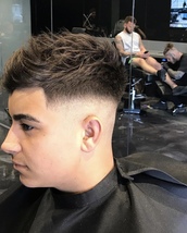 Heavy Skin fade Heavy Skin Fade with long textured quif.