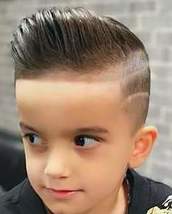 Kids pompadour fade Kids pompadour fade with lines on the side and some funky hair colour spray