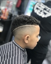 line up. Point cut, scissors on top to maximise natural curl. Heaving weighted skin fade with a cutt