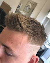 Lined up texture Skin fade with a side line. Textured top and styled with elevation powder by Fudge