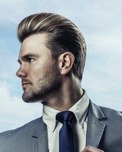 MODERN CLASSIC POMPADOUR A Side profile shot of a Modern classic pompadour, this shot creates a stro