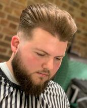 Modern Pompadour Low skin fade whit scissor cut o top and Pompadour style