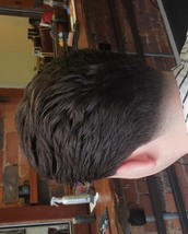 Modern pompadour Scissor cut blow dryed into a pompadour style with a 0 fade on the side burns and n