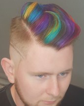 Muti coloured hairstyle Muti coloured haircut with a edge of art work.