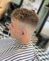 Natural curl on top A lovely fade into that natural curl on top