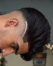 Natural flow Skin fade with a naturally flowing thrown back top