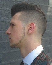 Peacock Pomp Graduated side and back down to a fade and heavily textured the top to build structure 