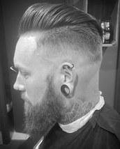 Pompador Classic pomp with skin fade and a beard trim to keep things sharp.