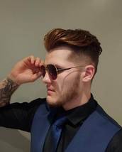 Posh & Polished Fade on sides and back with a natural hairline finish. Top was cut with a discon