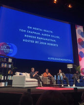 Public Speaker, Author and Campaigner On stage without hair at The Barbican with Romesh Raganathan, 