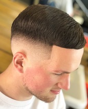 PURE Skin fade . A designed style to suit my clients needs . A nasty childhood scar from front to ba