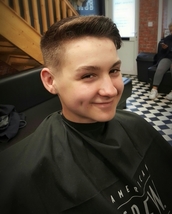 Quiffy clyro Low zero fade, combed over quiff incorporated into calf lick
