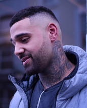 Reverse Skin fade with a reverse fade into the beard to spice it up