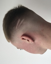 Scratches NOT Patches Choppy low maintenance top; with a smooth high fade and some gangster scratche