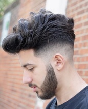Shapes and styles Mid detailed skin fade, with a beard trim and shape. Top cut and styled with waves