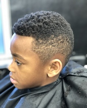 Sharp looking kid Shaped up youg un, with a fade and a trimmed but natural looking top