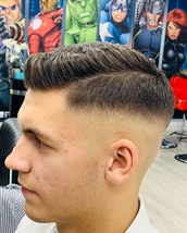 Skin Fade Skin fade medium to high fade and scissors on the top