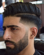 Skin fade with faded bear Bald fade with natural parting corners shaped up with faded beard