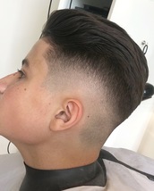 Skin faded Skin fade with a little pull back it up