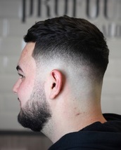 Skin faded Skin fade with a textured crop and a little beard fade