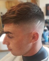 Sliced up Bald fade with two slices. Lots of texture through apex.