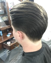 Slick... Scissor cut all round with a nape taper to keep it tidy..