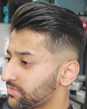 Slick back and disconnected skin fade Slick back and disconnected skinner with beard shape up Using 