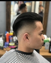 Slick rick. Disconnect side, low heavy crown area/blended, sharp hairline and drop fade.