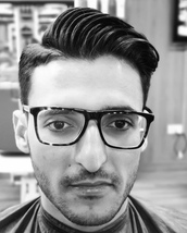 Slick volume Clipper fade from 1 to 1.5 and then continued fade using scissors over comb for soft mo