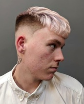 Spiral Crop 2 Skin fade with sharp outlines. Cropped fringe with spiralled spikey texture.