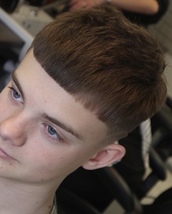 Straight Haircut, straight blunt fringe. Bit of a fade thing in there too...