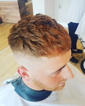 The ginger ninja Bald fade sides. Diffuser blow dried to enhance curls and waves.