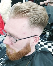 wave low fade high pomp stye top with natural wave. beard cut and shaped.