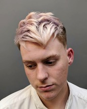 White Point Skin fade with defined outlines. Pointed fringe with spikey texture and flow.