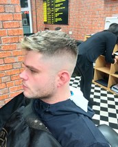 Will's fresh weekend High skin fade with textured top and plenty style play in the fringe